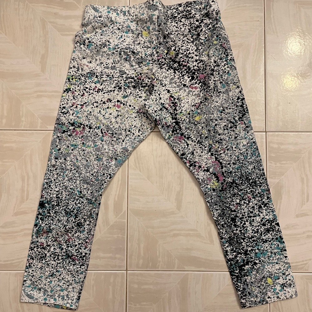 Nike multi colored capri length leggings. Size: Medium. NEW: without tags